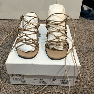 Chloe sandals color is nude and a size 7.5